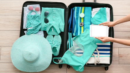 June-2024-Blog-Preparing to go on holiday-blue suitcase.png